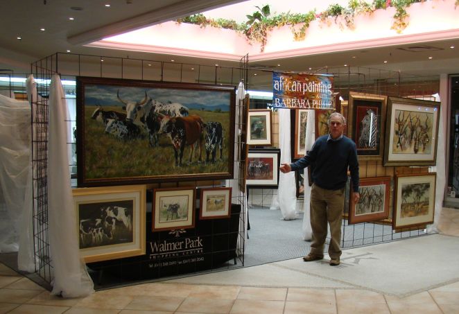 John (husband) at one of the entrances,& the big Nguni painting that sold on the last day.